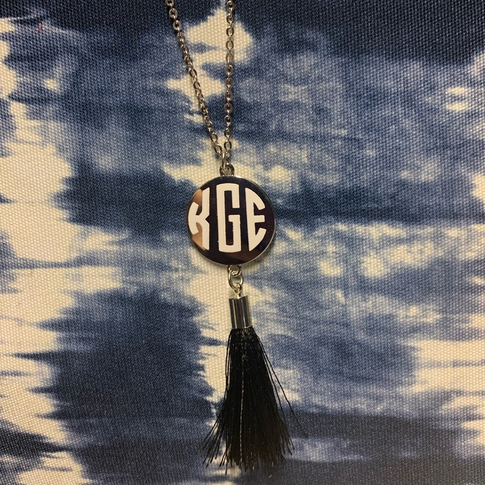 Monogram necklace with tassel.